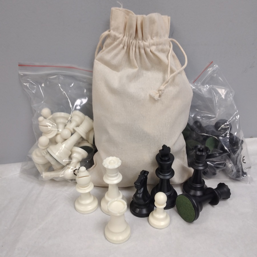 Standard chess pieces with king height 95 mm made of plastic in cotton pouch.
